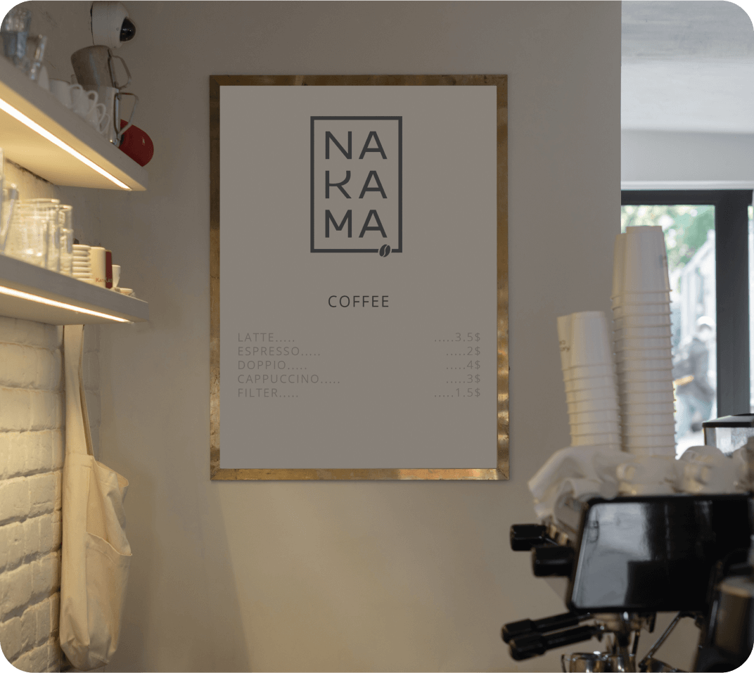 A poster featuring the Nakama logo and a coffee menu displayed on a wall.